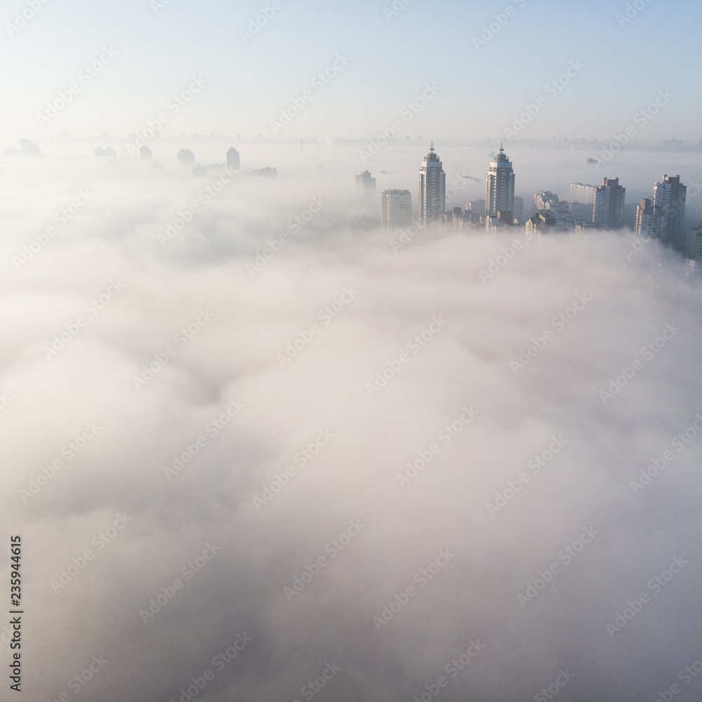 Aerial view of city covered with thick fog, Kyiv, Ukraine