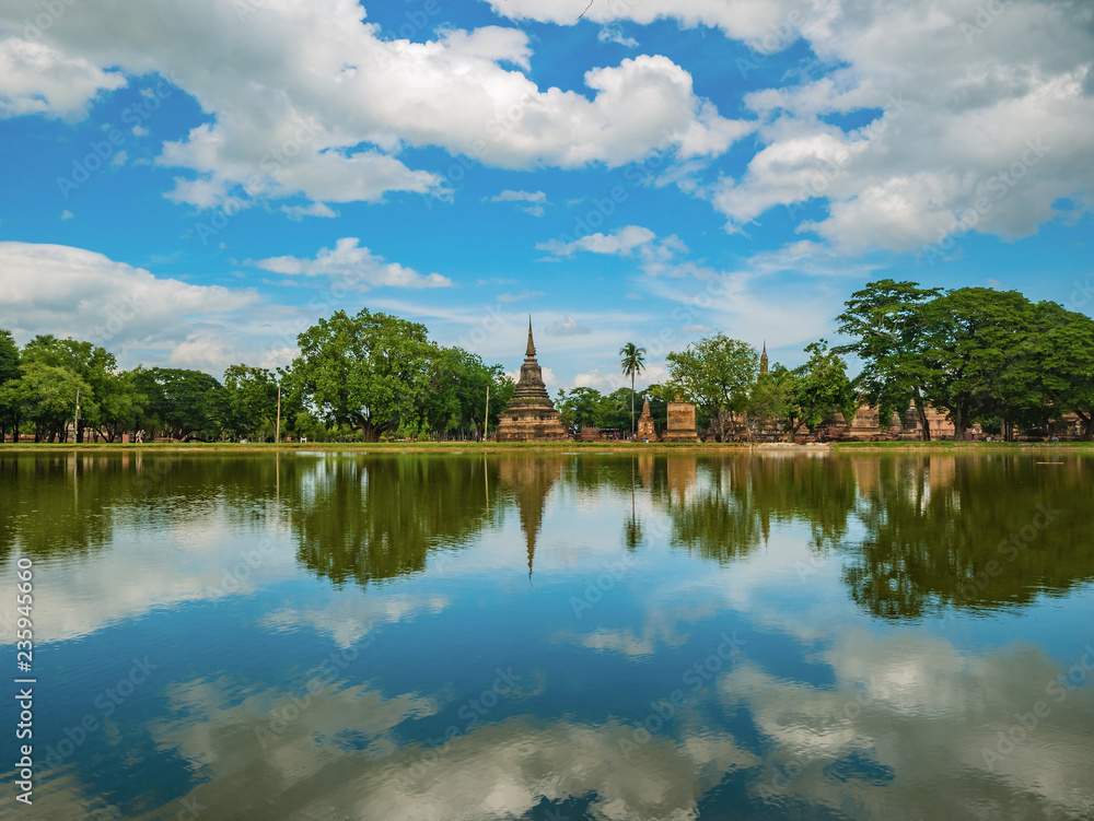 Ruin of Pagoda reflection in the water At sukhothai historical park,Sukhothai city Thailand