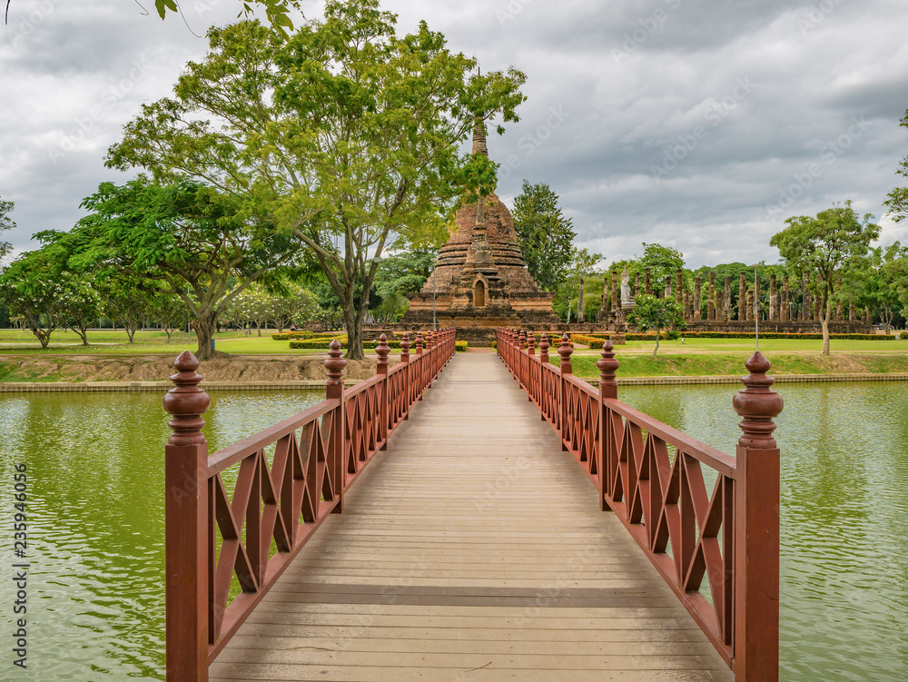 Wooden Bridge in sukhothai historical park,Sukhothai city Thailand Wooden Bridge in sukhothai historical park,Sukhothai city Thailand