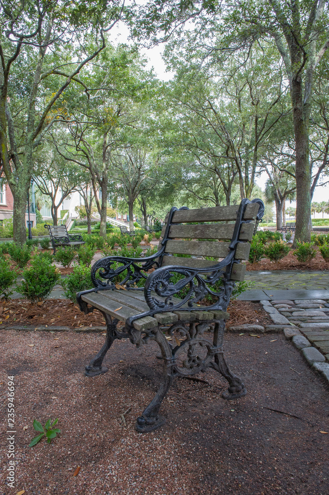 bench in a park in Charleston , South Carolina