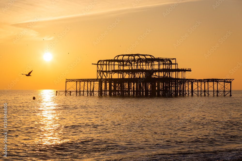 Sunset on a beautiful winter day over the ruins of Brighton's famous West Pier, UK