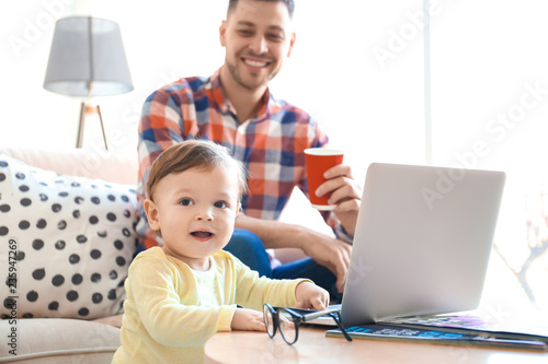 Handsome dad with his son u...