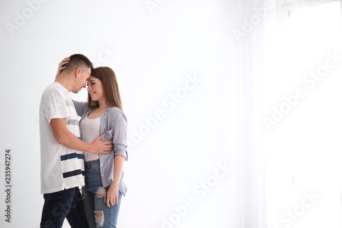 Cute young couple together indoors