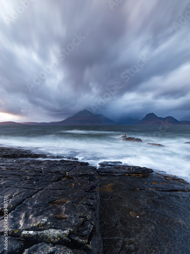 Storm clouds over the Cuilin Ridge and a rough sea at Elgol beach on the Isle of Skye, Scotland © Daniel