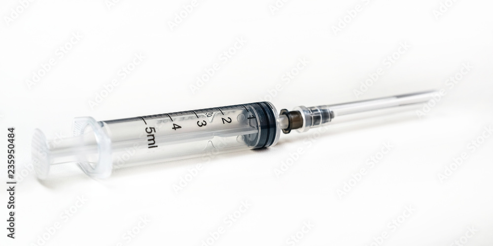 Disposable syringe. Plastic insulin syringe. The insulin syringe with the lid open shows sharp needles. Injection medicine. Medical equipment. Disposable syringe. Plastic insulin syringe. The insulin syringe with the lid open shows sharp needles. Injection medicine. Medical equipment.
