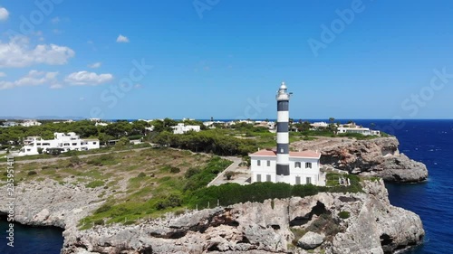 Aerial view, Flight over the Lighthous from Portocolom, Punta de ses Crestes,  Mallotca, Spain photo