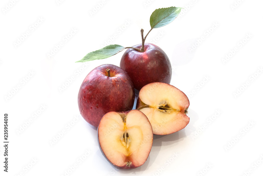 Fresh red apples with leaves isolated on white background Fresh red apples with leaves isolated on white background