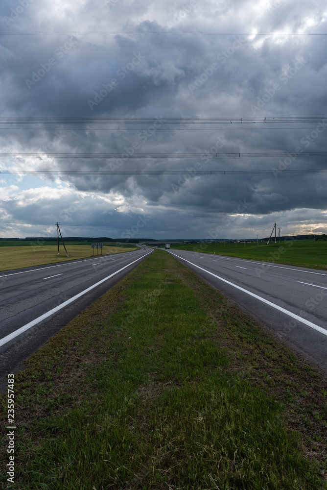 Highway before the storm. Dramatic clouds