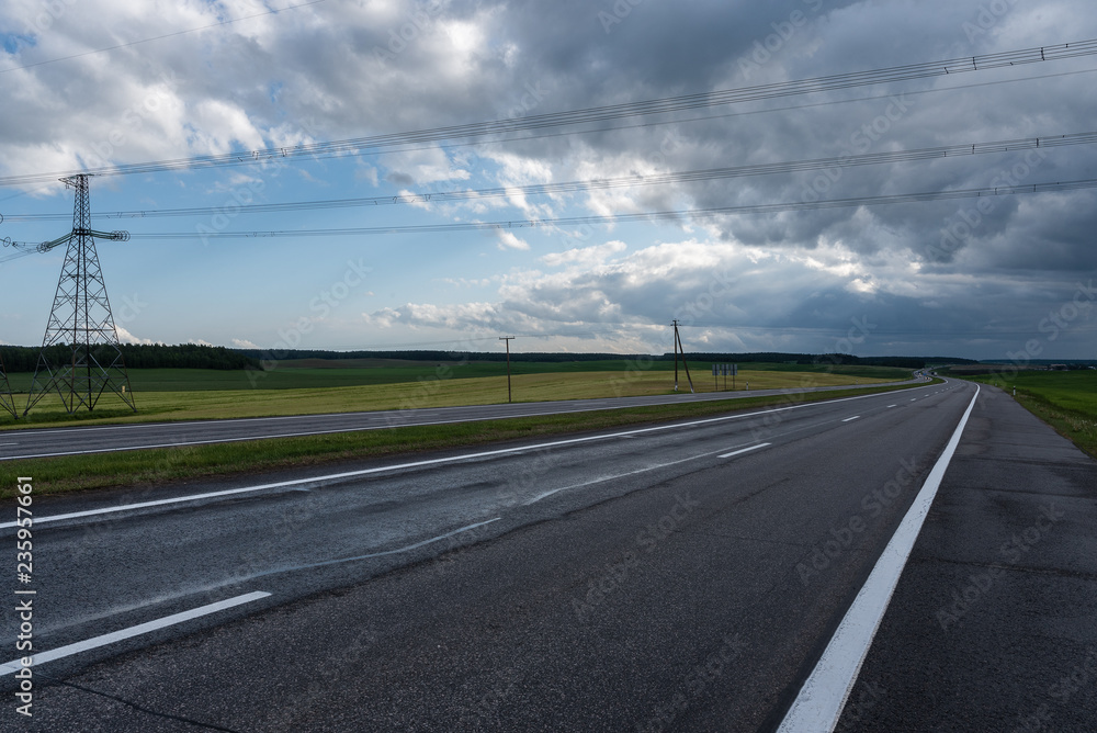 Fototapeta premium Highway before the storm. Dramatic clouds