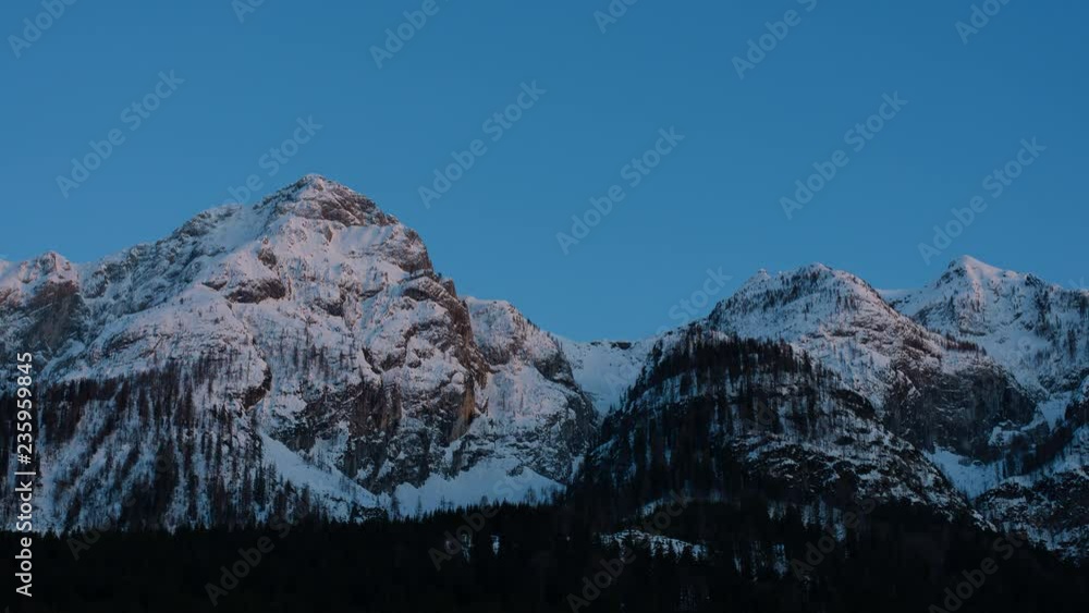 Time Lapse - Sunset with last sunligt in a landscape covered with fresh snow Time Lapse - Sunset with last sunligt in a landscape covered with fresh snow