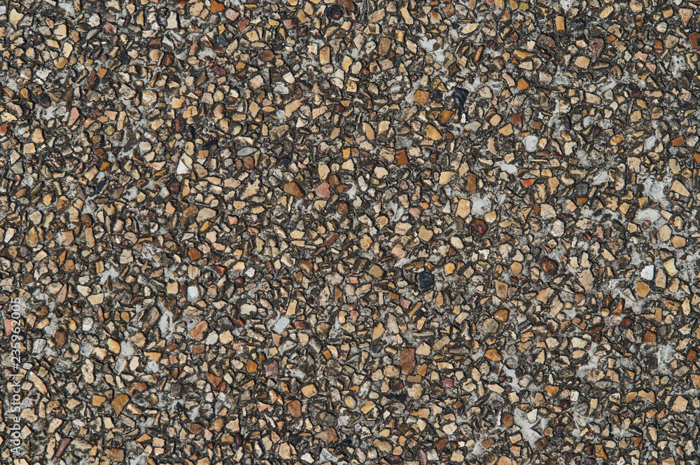 Road surface of small brown and beige pebbles. Road surface of small brown and beige pebbles.