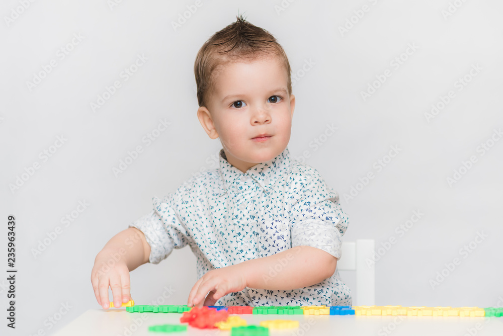 the baby is playing with the designer at home the baby is playing with the designer at home