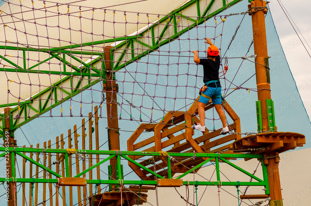 the child passes the obstacle course in the rope park