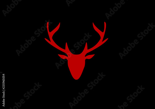 silhouette of a red deer head on a dark background