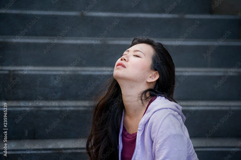 depressed Asian Korean student woman or bullied teenager sitting outdoors on street staircase overwhelmed and anxious feeling desperate suffering depression depressed Asian Korean student woman or bullied teenager sitting outdoors on street staircase overwhelmed and anxious feeling desperate suffering depression