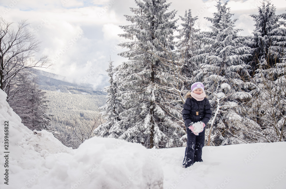 child in winter forest