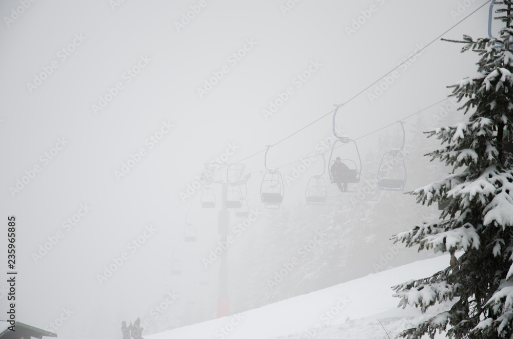 ski lift in foggy weather