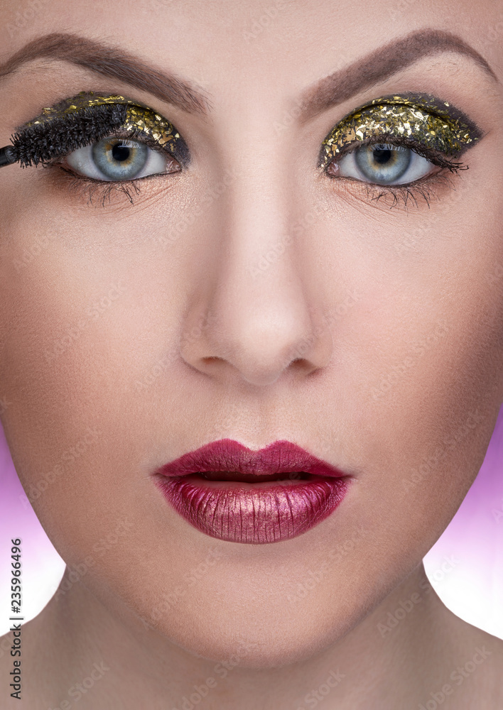 close-up portrait of female model during make-up close-up portrait of female model during make-up