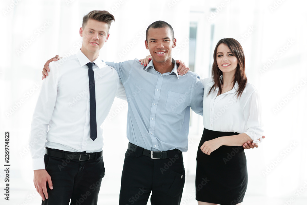 portrait of friendly business team in the background of the office portrait of friendly business team in the background of the office
