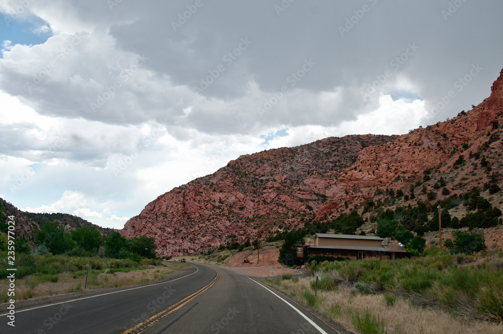 Fototapeta premium Road through red rock area in America
