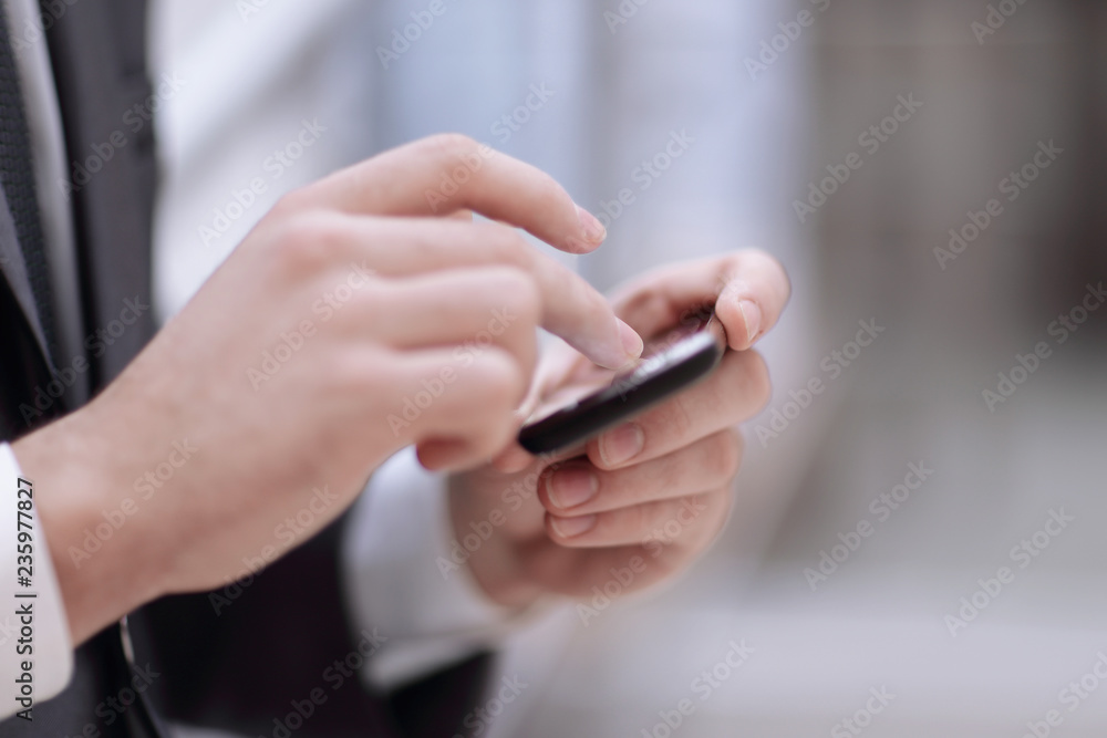 businessman hand use phone ,Close up of a man using mobile smart phone background