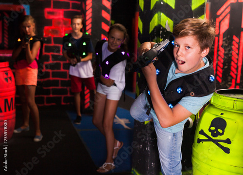 Boy having fun on lasertag arena © JackF