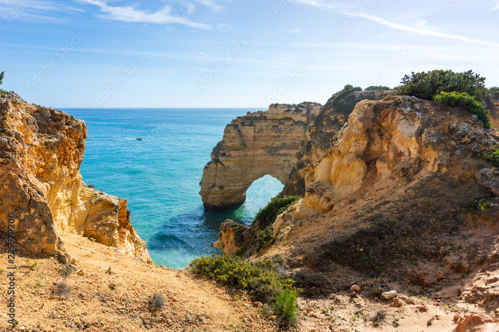 Cliffs and sea in sunny day near by Benagil Beach, Portugal, popular travel and holiday destination in Europe