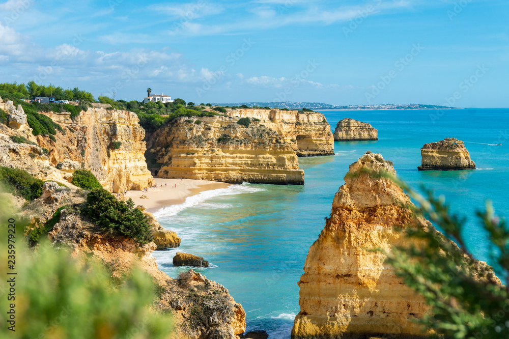 Fototapeta premium Cliffs and sea in sunny day near by Benagil Beach, Portugal, popular travel and holiday destination in Europe