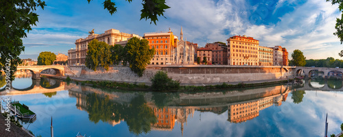 Panoramic view of Tiber riverside with Church of the Sacred Heart of Jesus in Prati and mirror reflection in the morning in Rome, Italy
