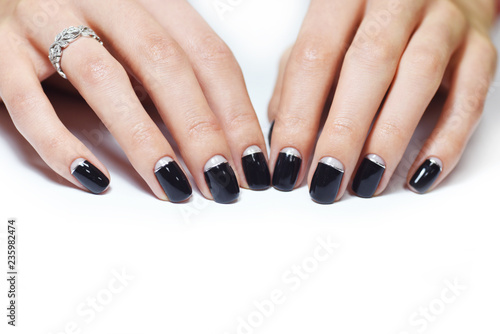 Beautiful hand with black manicure nails