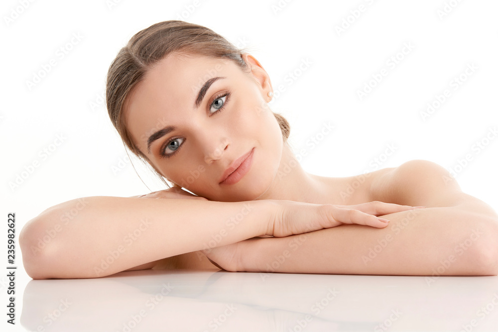 Young beauty portrait. Studio shot of a young woman with perfect skin. Young beauty portrait. Studio shot of a young woman with perfect skin.