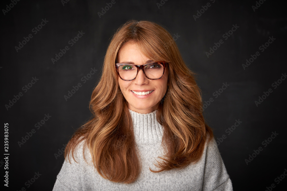 Close-up studio portrait of attractive middle aged woman Close-up studio portrait of attractive middle aged woman