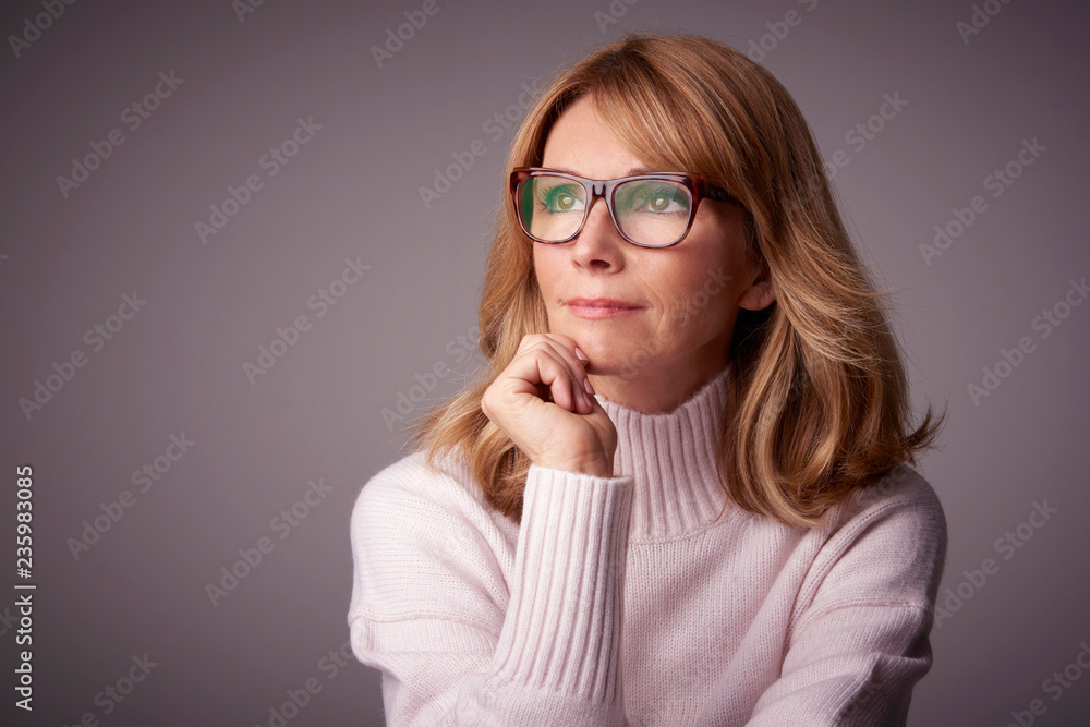 Close-up studio portrait of attractive middle aged woman Close-up studio portrait of attractive middle aged woman