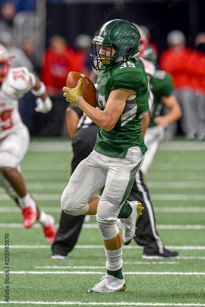 Great action shots of high school football player making amazing plays during a football game Great action shots of high school football player making amazing plays during a football game