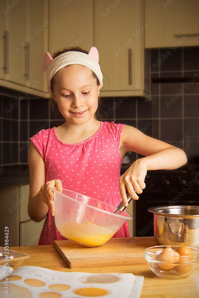 Cute little girl cooking at kitcen. Close up portret. Stock Photo Adobe Stock