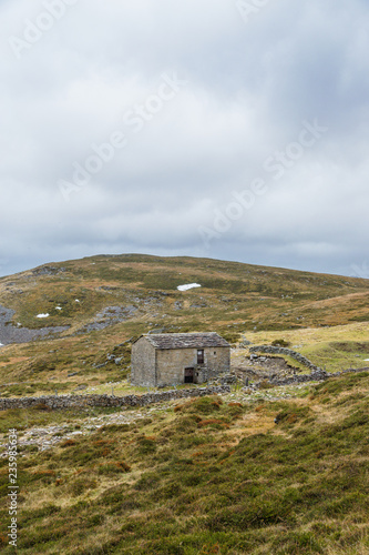 House in a mountain autumn landscape