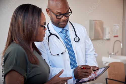 Doctor talking to woman