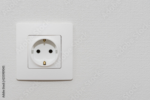 Alone outlet Electrical Socket on white baskgrounds. copy space for text , renovation , new home ownership concept