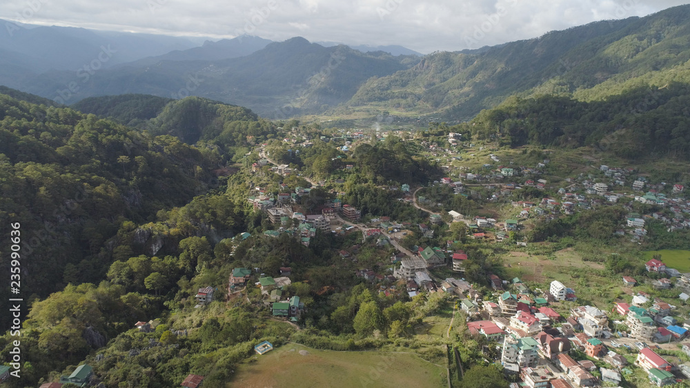 Aerial view town of Sagada, located in the mountainous province of Philippines. City in the valley among the mountains covered with forest. Sagada-Cordllera region-Luzon island.