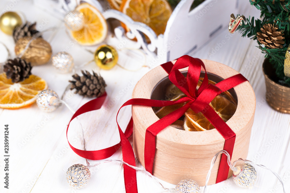 Christmas holidays composition with copy space for your text. Christmas gift box in craft paper with red ribbon. Christmas holidays composition with copy space for your text. Christmas gift box in craft paper with red ribbon.