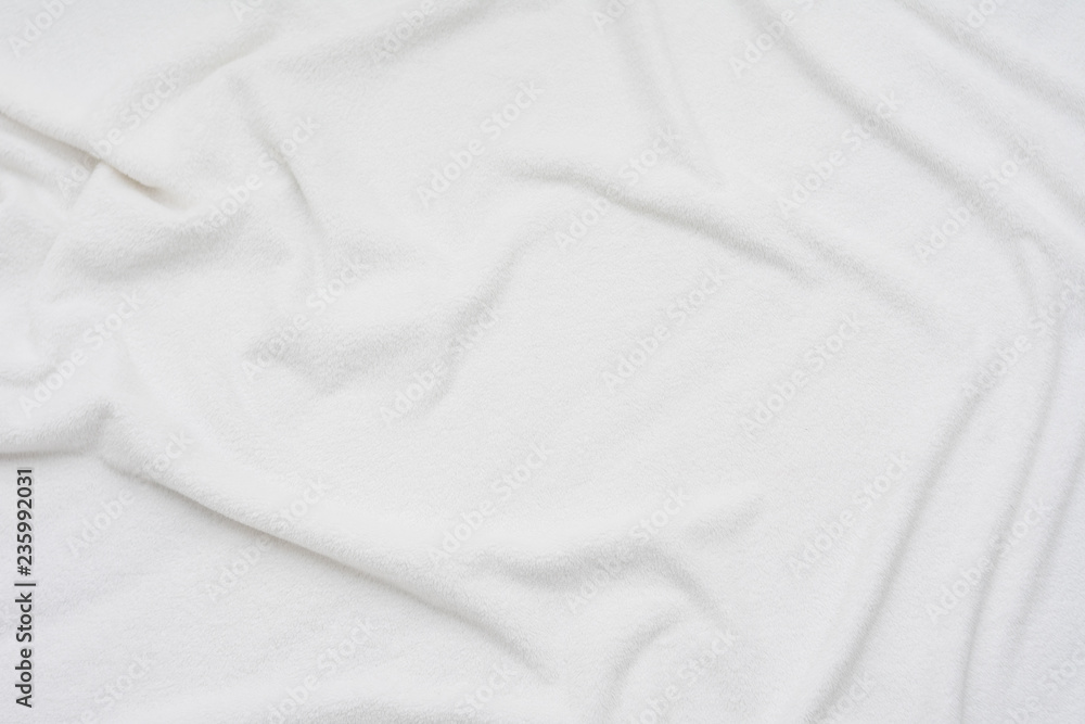 Fototapeta premium white crumpled blanket, top view