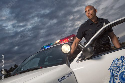 EMERGENCY SERVICES - Gang Unit Police Officer getting out of vehicle