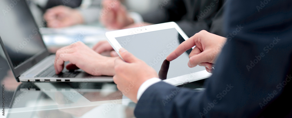 close up.businessman using digital tablet close up.businessman using digital tablet