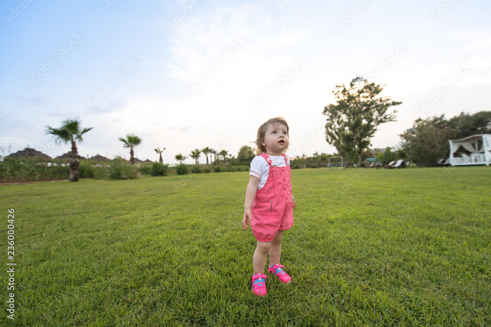 little girl spending time at backyard little girl spending time at backyard