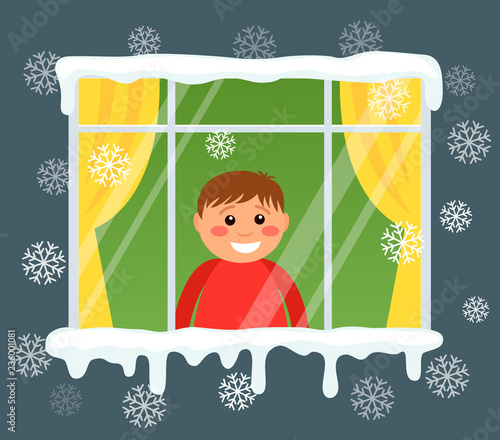 A little boy looks out the window and rejoices at the first snow. Snowfall from the street side. Flat vector illustration isolated