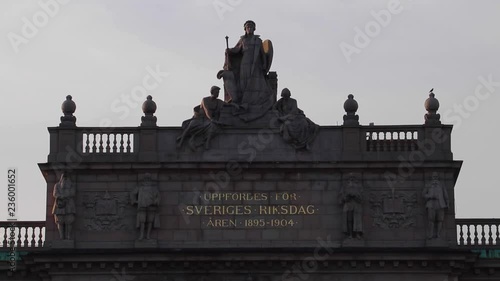 Top of the Swedish Parliament House in Stockholm, Sweden, seen from Norrbro. Cloudy sky in the background. photo