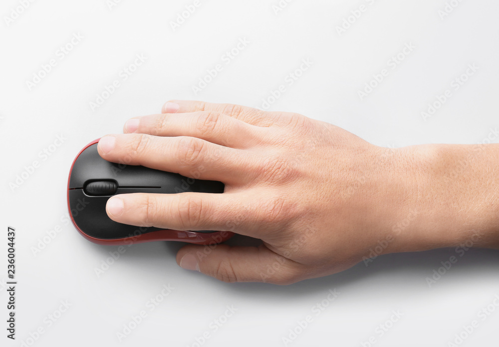 Man using computer mouse on white background, top view Man using computer mouse on white background, top view