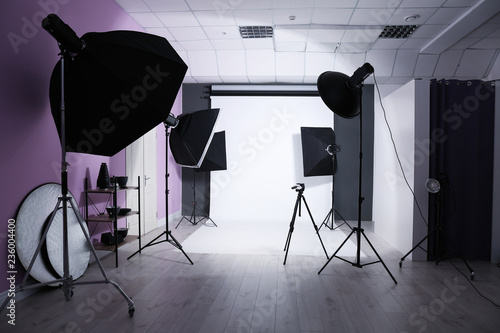 Interior of modern photo studio with professional equipment