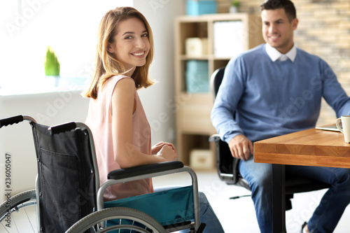 Young woman in wheelchair w...