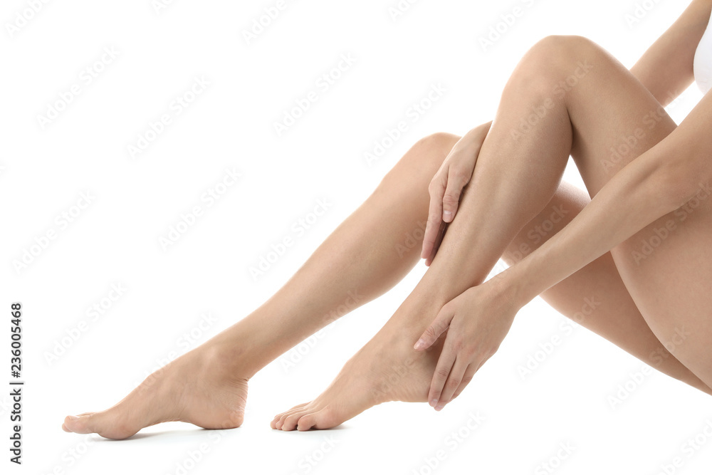 Young woman with beautiful long legs on white background, closeup Young woman with beautiful long legs on white background, closeup